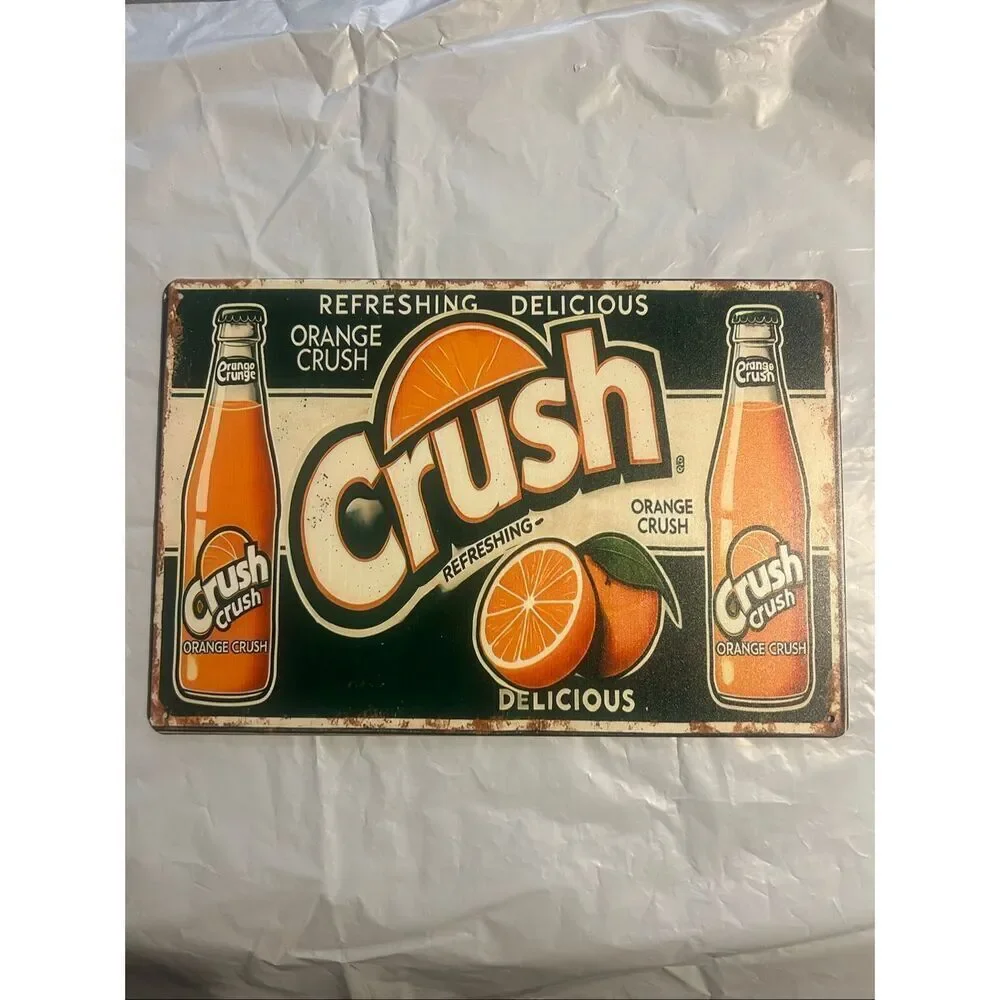 Classic vintage-inspired Orange Crush metal wall sign featuring retro soda bottl
